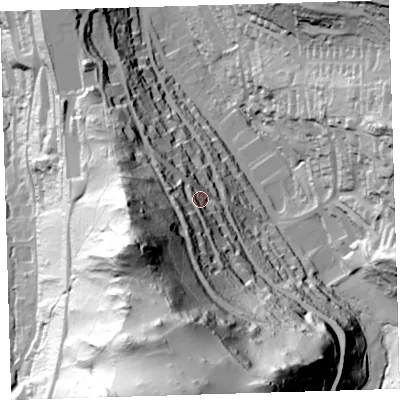 Shaded relief map of the ground around EX348EF, computed from Environment Agency LiDAR. The ground here sits at about 76 m above sea level and falls 136 m across the surrounding 800 m. Surface water reaching this point runs off ground lying to the south, 105.7 m higher.