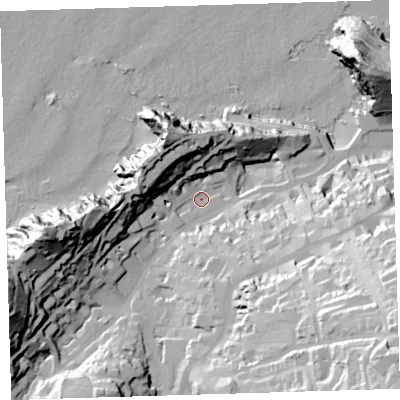 Shaded relief map of the ground around EX348FT, computed from Environment Agency LiDAR. The ground here sits at about 13 m above sea level and falls 74 m across the surrounding 800 m. Surface water reaching this point runs off ground lying to the south-east, 63.1 m higher.