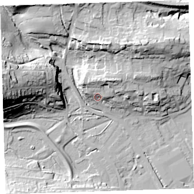 Shaded relief map of the ground around EX392LN, computed from Environment Agency LiDAR. The ground here sits at about 11 m above sea level and falls 42 m across the surrounding 800 m. Surface water reaching this point runs off ground lying to the north-north-east, 12.7 m higher.