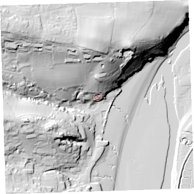 Shaded relief map of the ground around EX392RJ, computed from Environment Agency LiDAR. The ground here sits at about 12 m above sea level and falls 65 m across the surrounding 800 m. Surface water reaching this point runs off ground lying to the north, 51.3 m higher.