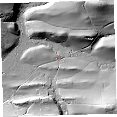 Shaded relief map of the ground around EX394NQ, computed from Environment Agency LiDAR. The ground here sits at about 9 m above sea level and falls 53 m across the surrounding 800 m. Surface water reaching this point runs off ground lying to the south-south-east, 6.3 m higher.