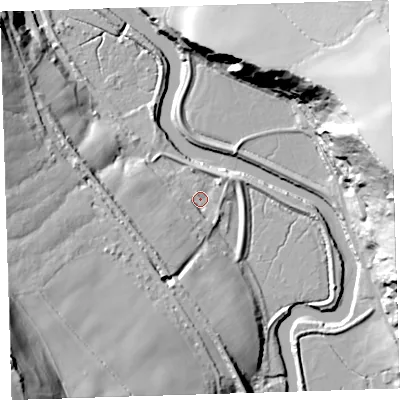 Shaded relief map of the ground around EX395JE, computed from Environment Agency LiDAR. The ground here sits at about 6 m above sea level and falls 65 m across the surrounding 800 m. Surface water reaching this point runs off ground lying to the south, 15.6 m higher.