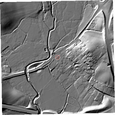 Shaded relief map of the ground around EX52NJ, computed from Environment Agency LiDAR. The ground here sits at about 9 m above sea level and falls 21 m across the surrounding 800 m. Surface water reaching this point runs off ground lying to the east-north-east, 16.5 m higher.