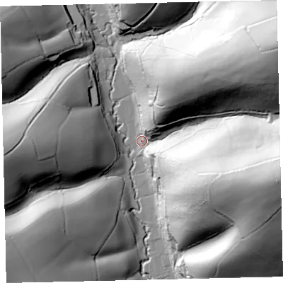 Shaded relief map of the ground around EX67AE, computed from Environment Agency LiDAR. The ground here sits at about 69 m above sea level and falls 87 m across the surrounding 800 m. Surface water reaching this point runs off ground lying to the north-east, 79.8 m higher.