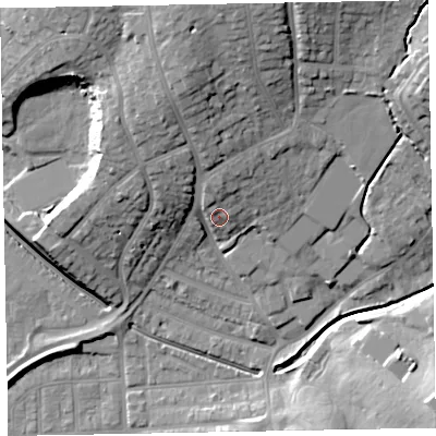 Shaded relief map of the ground around EX83HP, computed from Environment Agency LiDAR. The ground here sits at about 12 m above sea level and falls 25 m across the surrounding 800 m. Surface water reaching this point runs off ground lying to the north-north-west, 5.8 m higher.