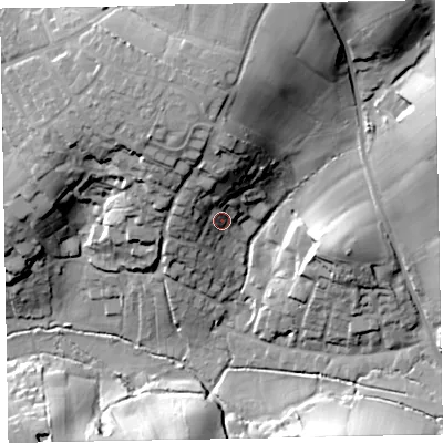 Shaded relief map of the ground around EX85LD, computed from Environment Agency LiDAR. The ground here sits at about 18 m above sea level and falls 38 m across the surrounding 800 m. Surface water reaching this point runs off ground lying to the north, 21.0 m higher.