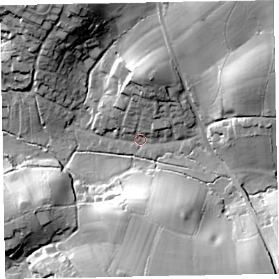 Shaded relief map of the ground around EX85LH, computed from Environment Agency LiDAR. The ground here sits at about 11 m above sea level and falls 45 m across the surrounding 800 m. Surface water reaching this point runs off ground lying to the north, 18.4 m higher.