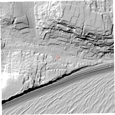 Shaded relief map of the ground around EX96LD, computed from Environment Agency LiDAR. The ground here sits at about 12 m above sea level and falls 61 m across the surrounding 800 m. Surface water reaching this point runs off ground lying to the south-west, 43.0 m higher.