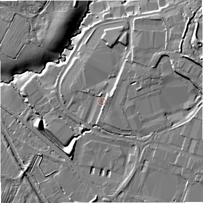 Shaded relief map of the ground around GL103SX, computed from Environment Agency LiDAR. The ground here sits at about 29 m above sea level and falls 17 m across the surrounding 800 m. Surface water reaching this point runs off ground lying to the east, 2.7 m higher.