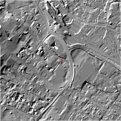 Shaded relief map of the ground around GL11AP, computed from Environment Agency LiDAR. The ground here sits at about 16 m above sea level and falls 7 m across the surrounding 800 m. Surface water reaching this point runs off ground lying to the east, 4.7 m higher.