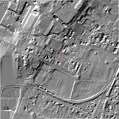 Shaded relief map of the ground around GL11JZ, computed from Environment Agency LiDAR. The ground here sits at about 13 m above sea level and falls 11 m across the surrounding 800 m. Surface water reaching this point runs off ground lying to the north-north-east, 8.4 m higher.