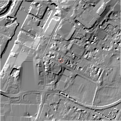 Shaded relief map of the ground around GL11UY, computed from Environment Agency LiDAR. The ground here sits at about 15 m above sea level and falls 15 m across the surrounding 800 m. Surface water reaching this point runs off ground lying to the west, 0.8 m higher.