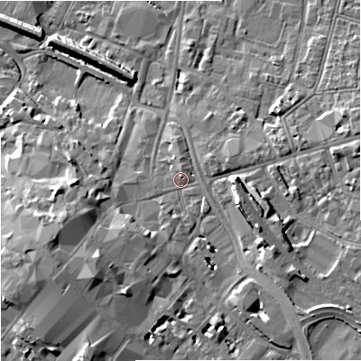 Shaded relief map of the ground around GL12AA, computed from Environment Agency LiDAR. The ground here sits at about 15 m above sea level and falls 11 m across the surrounding 800 m. Surface water reaching this point runs off ground lying to the south-west, 6.7 m higher.