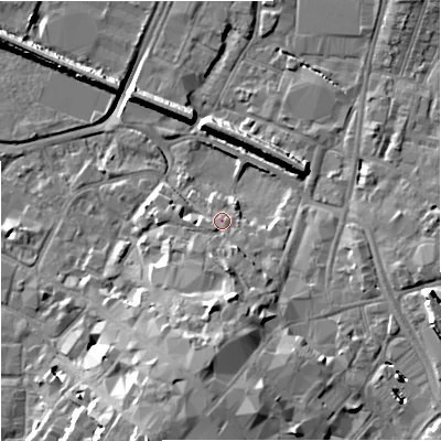 Shaded relief map of the ground around GL12BH, computed from Environment Agency LiDAR. The ground here sits at about 13 m above sea level and falls 13 m across the surrounding 800 m. Surface water reaching this point runs off ground lying to the south, 4.8 m higher.