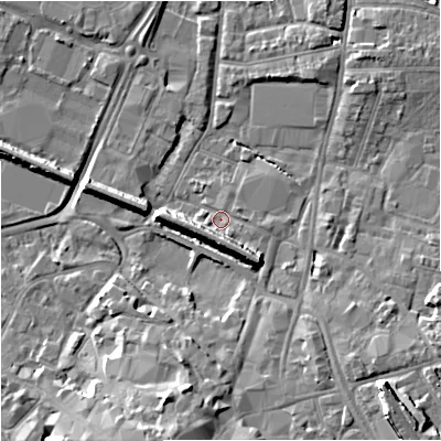 Shaded relief map of the ground around GL12BS, computed from Environment Agency LiDAR. The ground here sits at about 11 m above sea level and falls 12 m across the surrounding 800 m. Surface water reaching this point runs off ground lying to the south-east, 6.6 m higher.