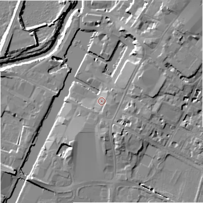 Shaded relief map of the ground around GL12DQ, computed from Environment Agency LiDAR. The ground here sits at about 13 m above sea level and falls 15 m across the surrounding 800 m. Surface water reaching this point runs off ground lying to the south-south-east, 2.8 m higher.