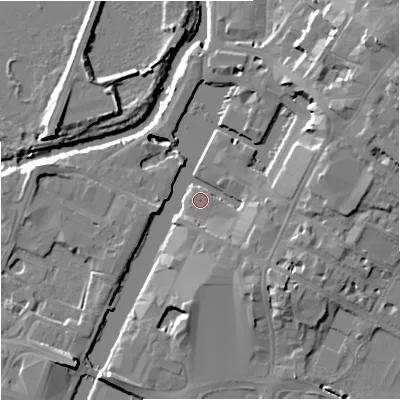 Shaded relief map of the ground around GL12EH, computed from Environment Agency LiDAR. The ground here sits at about 11 m above sea level and falls 15 m across the surrounding 800 m. Surface water reaching this point runs off ground lying to the east-north-east, 10.9 m higher.