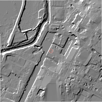 Shaded relief map of the ground around GL12EN, computed from Environment Agency LiDAR. The ground here sits at about 11 m above sea level and falls 15 m across the surrounding 800 m. Surface water reaching this point runs off ground lying to the east-north-east, 12.1 m higher.