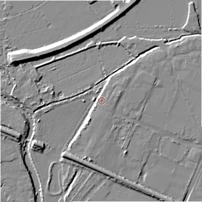 Shaded relief map of the ground around GL12ET, computed from Environment Agency LiDAR. The ground here sits at about 13 m above sea level and falls 9 m across the surrounding 800 m. Surface water reaching this point runs off ground lying to the east, 4.5 m higher.