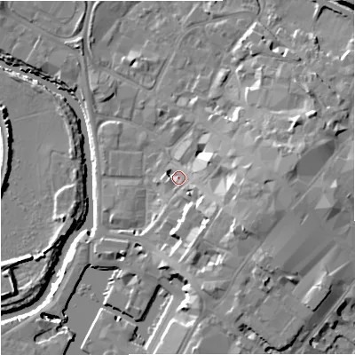 Shaded relief map of the ground around GL12JP, computed from Environment Agency LiDAR. The ground here sits at about 13 m above sea level and falls 15 m across the surrounding 800 m. Surface water reaching this point runs off ground lying to the east-south-east, 8.9 m higher.