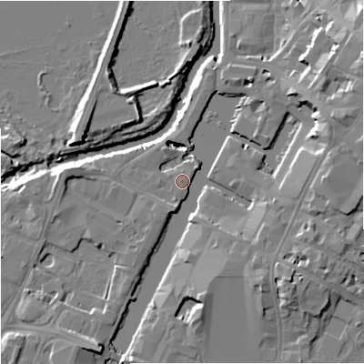 Shaded relief map of the ground around GL12LG, computed from Environment Agency LiDAR. The ground here sits at about 11 m above sea level and falls 14 m across the surrounding 800 m. Surface water reaching this point runs off ground lying to the south-south-west, 6.3 m higher.