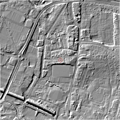 Shaded relief map of the ground around GL12QG, computed from Environment Agency LiDAR. The ground here sits at about 12 m above sea level and falls 9 m across the surrounding 800 m. Surface water reaching this point runs off ground lying to the east, 1.6 m higher.