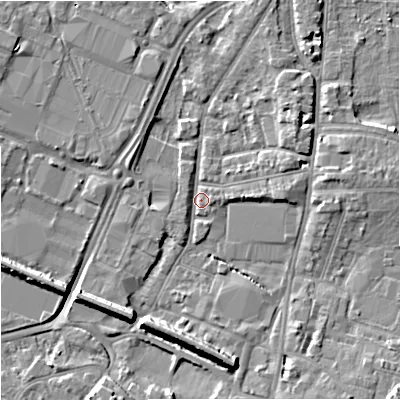 Shaded relief map of the ground around GL12QN, computed from Environment Agency LiDAR. The ground here sits at about 11 m above sea level and falls 9 m across the surrounding 800 m. Surface water reaching this point runs off ground lying to the north-east, 3.6 m higher.
