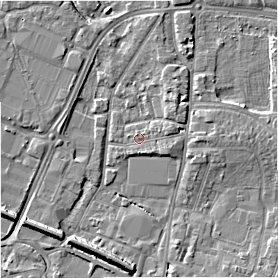 Shaded relief map of the ground around GL12QQ, computed from Environment Agency LiDAR. The ground here sits at about 12 m above sea level and falls 9 m across the surrounding 800 m. Surface water reaching this point runs off ground lying to the east-south-east, 1.7 m higher.
