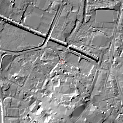 Shaded relief map of the ground around GL12QR, computed from Environment Agency LiDAR. The ground here sits at about 11 m above sea level and falls 14 m across the surrounding 800 m. Surface water reaching this point runs off ground lying to the south, 10.4 m higher.