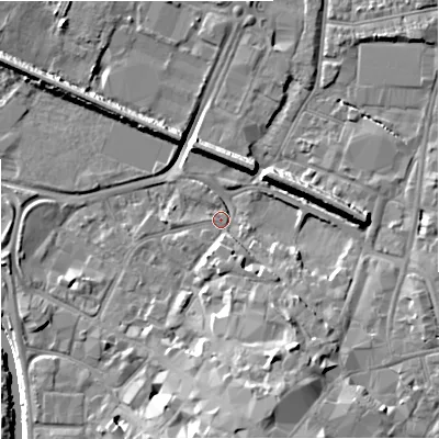 Shaded relief map of the ground around GL12QS, computed from Environment Agency LiDAR. The ground here sits at about 11 m above sea level and falls 14 m across the surrounding 800 m. Surface water reaching this point runs off ground lying to the south-south-east, 10.4 m higher.