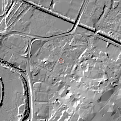 Shaded relief map of the ground around GL12QX, computed from Environment Agency LiDAR. The ground here sits at about 11 m above sea level and falls 15 m across the surrounding 800 m. Surface water reaching this point runs off ground lying to the south-east, 9.2 m higher.
