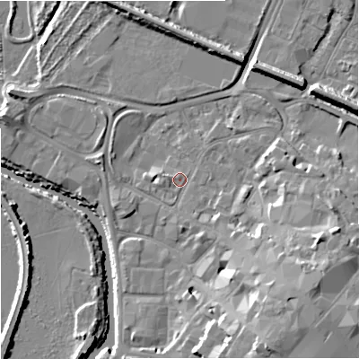 Shaded relief map of the ground around GL12QZ, computed from Environment Agency LiDAR. The ground here sits at about 11 m above sea level and falls 15 m across the surrounding 800 m. Surface water reaching this point runs off ground lying to the south-east, 9.1 m higher.
