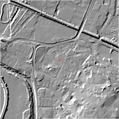 Shaded relief map of the ground around GL12TA, computed from Environment Agency LiDAR. The ground here sits at about 11 m above sea level and falls 14 m across the surrounding 800 m. Surface water reaching this point runs off ground lying to the south-east, 9.5 m higher.