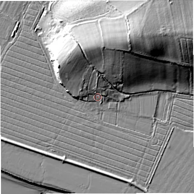 Shaded relief map of the ground around GL141RE, computed from Environment Agency LiDAR. The ground here sits at about 10 m above sea level and falls 25 m across the surrounding 800 m. Surface water reaching this point runs off ground lying to the north, 6.5 m higher.
