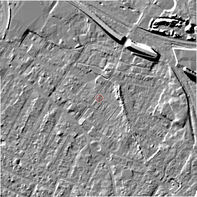 Shaded relief map of the ground around GL14AE, computed from Environment Agency LiDAR. The ground here sits at about 19 m above sea level and falls 15 m across the surrounding 800 m. Surface water reaching this point runs off ground lying to the east-north-east, 2.6 m higher.