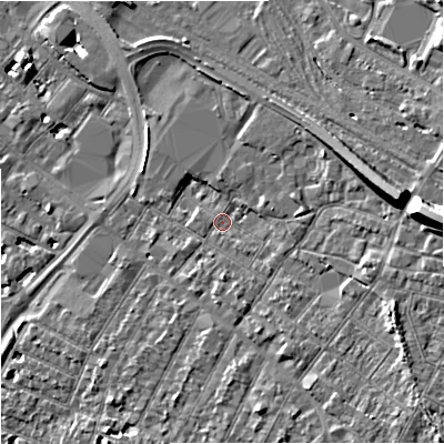 Shaded relief map of the ground around GL14AP, computed from Environment Agency LiDAR. The ground here sits at about 18 m above sea level and falls 15 m across the surrounding 800 m. Surface water reaching this point runs off ground lying to the east, 12.2 m higher.