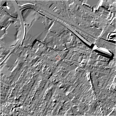 Shaded relief map of the ground around GL14AU, computed from Environment Agency LiDAR. The ground here sits at about 18 m above sea level and falls 15 m across the surrounding 800 m. Surface water reaching this point runs off ground lying to the east, 12.1 m higher.