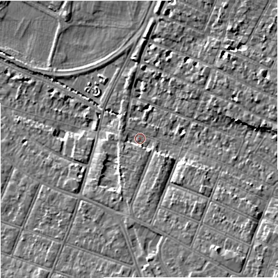 Shaded relief map of the ground around GL14UR, computed from Environment Agency LiDAR. The ground here sits at about 15 m above sea level and falls 10 m across the surrounding 800 m. Surface water reaching this point runs off ground lying to the south-east, 6.9 m higher.