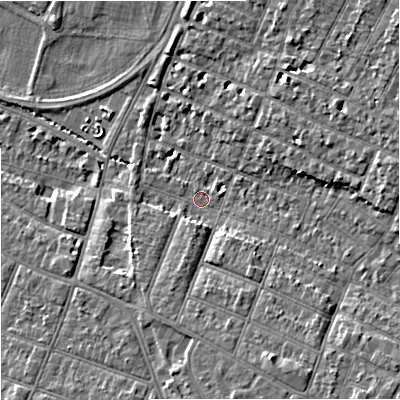 Shaded relief map of the ground around GL14US, computed from Environment Agency LiDAR. The ground here sits at about 15 m above sea level and falls 10 m across the surrounding 800 m. Surface water reaching this point runs off ground lying to the south-south-east, 6.9 m higher.