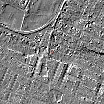 Shaded relief map of the ground around GL14UW, computed from Environment Agency LiDAR. The ground here sits at about 15 m above sea level and falls 10 m across the surrounding 800 m. Surface water reaching this point runs off ground lying to the south-east, 6.9 m higher.