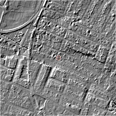 Shaded relief map of the ground around GL14XE, computed from Environment Agency LiDAR. The ground here sits at about 15 m above sea level and falls 9 m across the surrounding 800 m. Surface water reaching this point runs off ground lying to the south-east, 1.8 m higher.