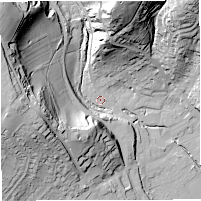Shaded relief map of the ground around GL155LB, computed from Environment Agency LiDAR. The ground here sits at about 12 m above sea level and falls 64 m across the surrounding 800 m. Surface water reaching this point runs off ground lying to the north, 62.0 m higher.