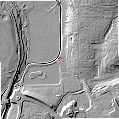 Shaded relief map of the ground around GL155PU, computed from Environment Agency LiDAR. The ground here sits at about 9 m above sea level and falls 20 m across the surrounding 800 m. Surface water reaching this point runs off ground lying to the north-north-east, 18.4 m higher.