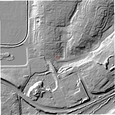 Shaded relief map of the ground around GL155PY, computed from Environment Agency LiDAR. The ground here sits at about 11 m above sea level and falls 21 m across the surrounding 800 m. Surface water reaching this point runs off ground lying to the north-east, 19.2 m higher.