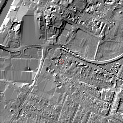 Shaded relief map of the ground around GL15AU, computed from Environment Agency LiDAR. The ground here sits at about 12 m above sea level and falls 8 m across the surrounding 800 m. Surface water reaching this point runs off ground lying to the south-east, 5.6 m higher.