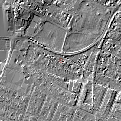 Shaded relief map of the ground around GL15AX, computed from Environment Agency LiDAR. The ground here sits at about 13 m above sea level and falls 8 m across the surrounding 800 m. Surface water reaching this point runs off ground lying to the south-east, 6.8 m higher.