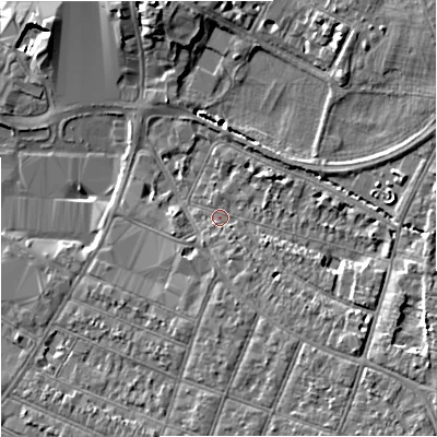 Shaded relief map of the ground around GL15AY, computed from Environment Agency LiDAR. The ground here sits at about 13 m above sea level and falls 8 m across the surrounding 800 m. Surface water reaching this point runs off ground lying to the south, 1.1 m higher.