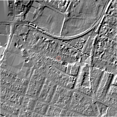 Shaded relief map of the ground around GL15AZ, computed from Environment Agency LiDAR. The ground here sits at about 13 m above sea level and falls 10 m across the surrounding 800 m. Surface water reaching this point runs off ground lying to the south-east, 5.6 m higher.