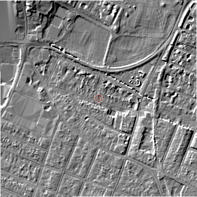 Shaded relief map of the ground around GL15BA, computed from Environment Agency LiDAR. The ground here sits at about 13 m above sea level and falls 9 m across the surrounding 800 m. Surface water reaching this point runs off ground lying to the south-east, 5.6 m higher.