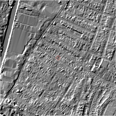 Shaded relief map of the ground around GL15HG, computed from Environment Agency LiDAR. The ground here sits at about 12 m above sea level and falls 6 m across the surrounding 800 m. Surface water reaching this point runs off ground lying to the south-east, 4.7 m higher.